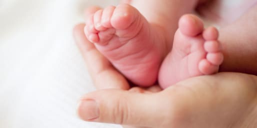 mum-holding-baby-foot